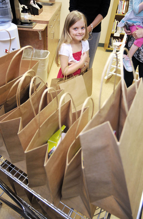 Six-year-old Charlie Hobbs waits with anticipation to start delivering care packages to cancer patients getting treatment at St. Vincent Anderson Regional Hospital's Cancer Center this past Monday. ( John P. Cleary/AP Photo/The Herald Bulletin)