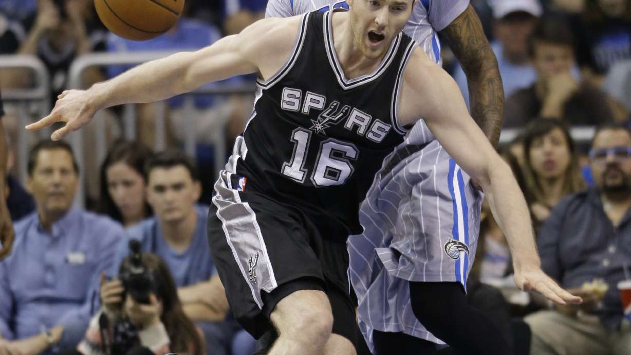 Spurs secure playoff berth with 103-91 win over Magic