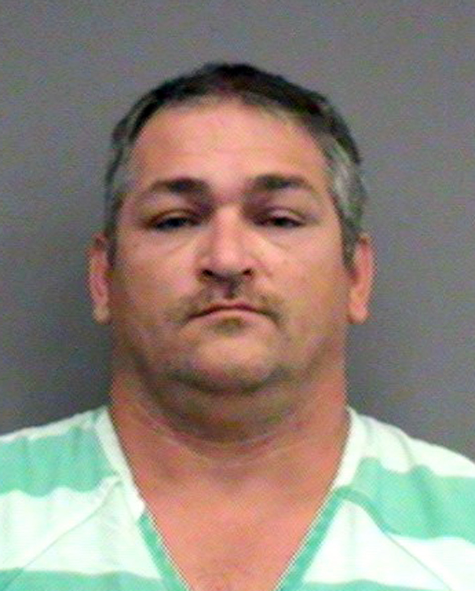 Informant posing as Klan hit man leads to prison guard bust