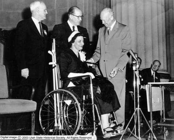Men, right to left: Senator Watkins, Ezra Taft Benson, and Dwight Eisenhower. Dwight Eisenhower (Republican) served as President of the United States from 1953-61. Ezra Taft Benson served as Secretary of Agriculture under President Eisenhower and later served as president of the LDS Church.