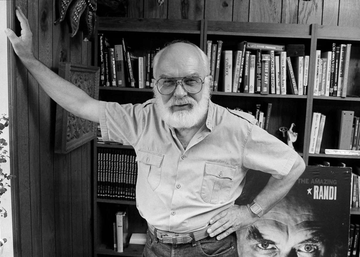 "I'm an explainer," says James Randi, shown at home in Sunrise, Fla., Aug. 27, 1986. A magician himself, known as "The Amazing Randi," he explains, "I'm certainly not trying to do in magic. But I'm obsessed with exposing those who use it fraudulently." (AP Photo/Terry Renna)