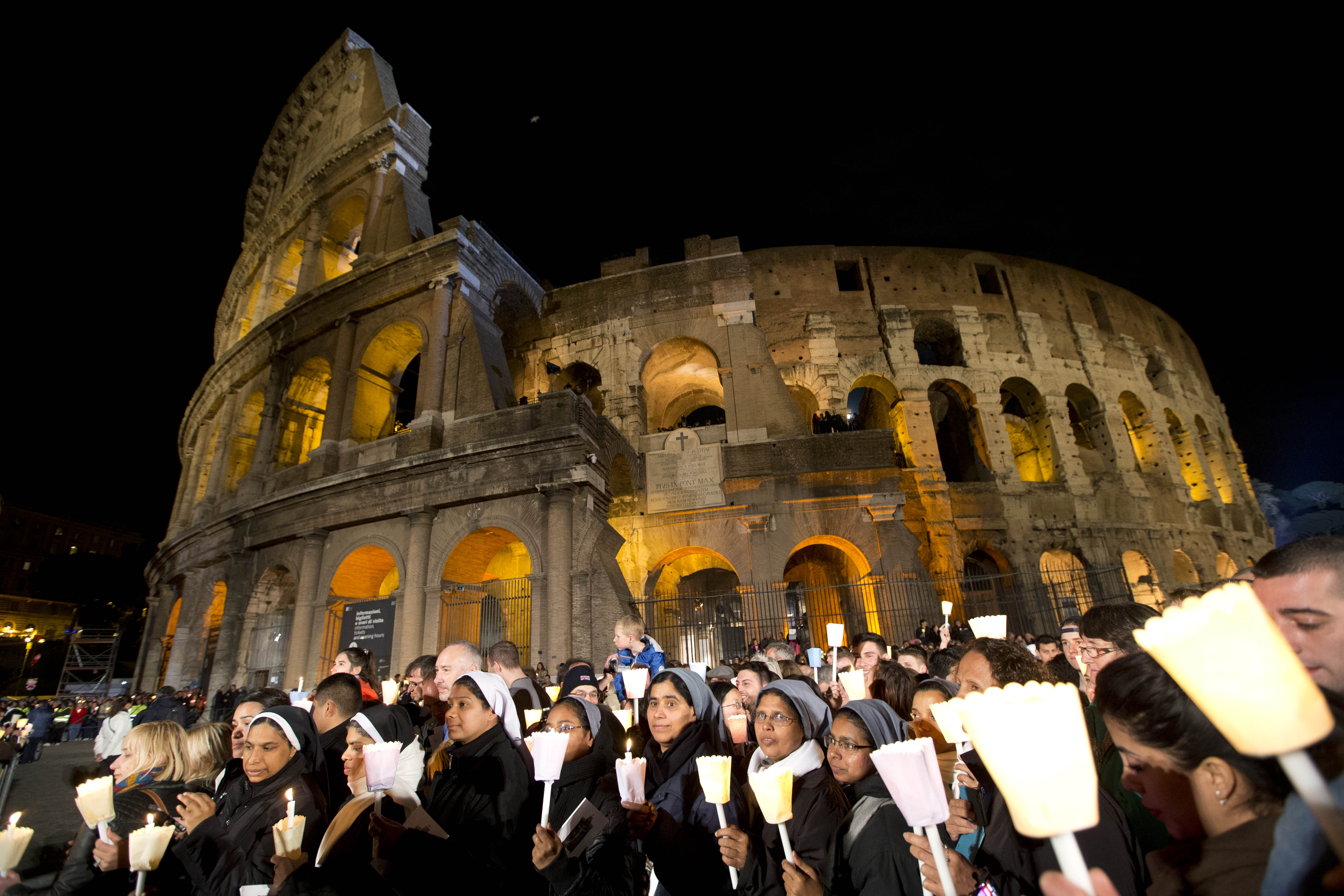 Pope presides over Good Friday procession at Colosseum