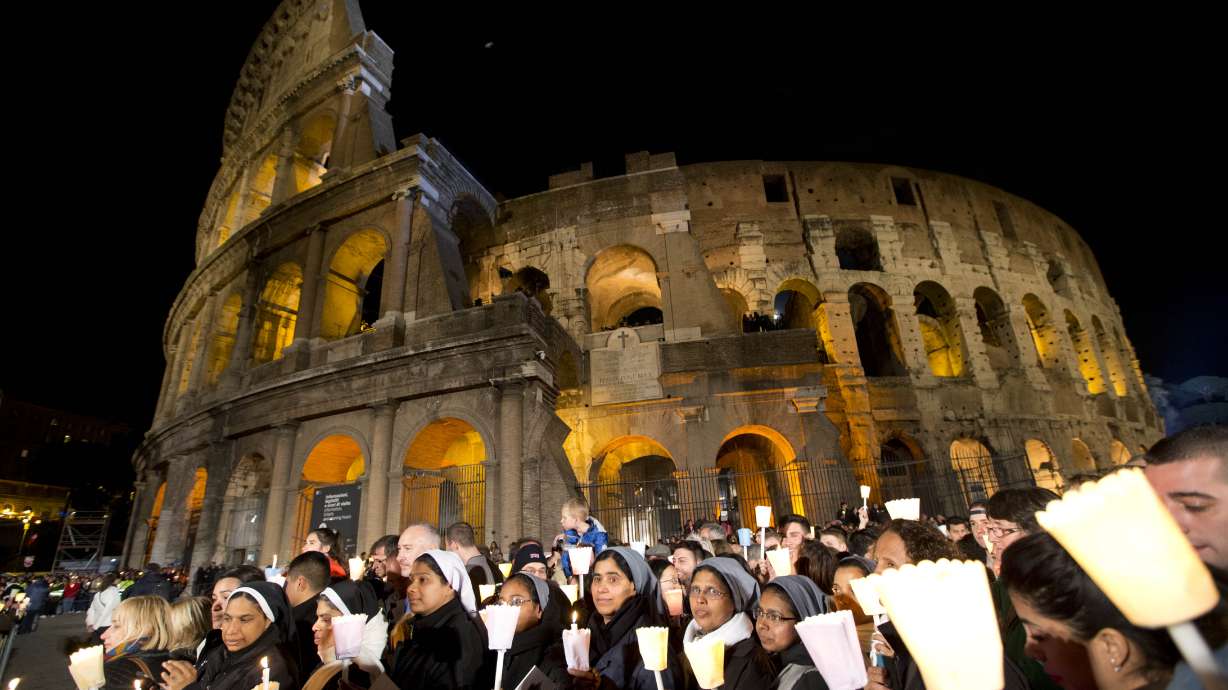 Pope presides over Good Friday procession at Colosseum