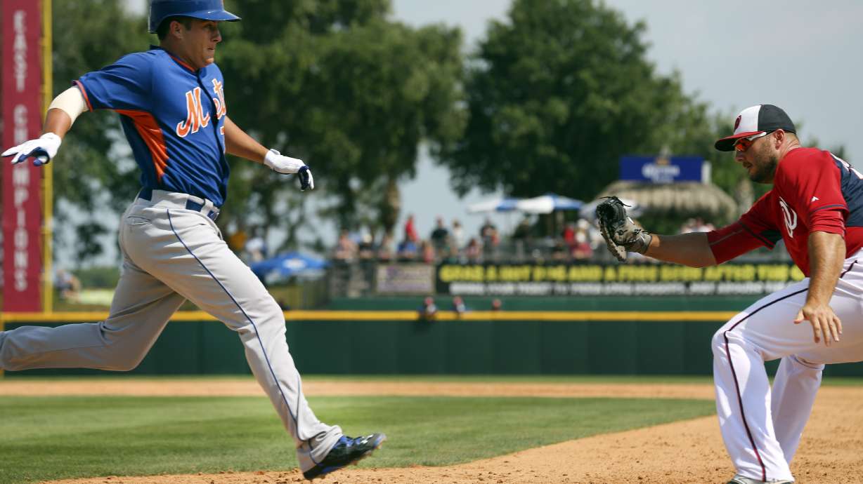 Robinson makes Nationals; Carp, Hill re-assigned to minors
