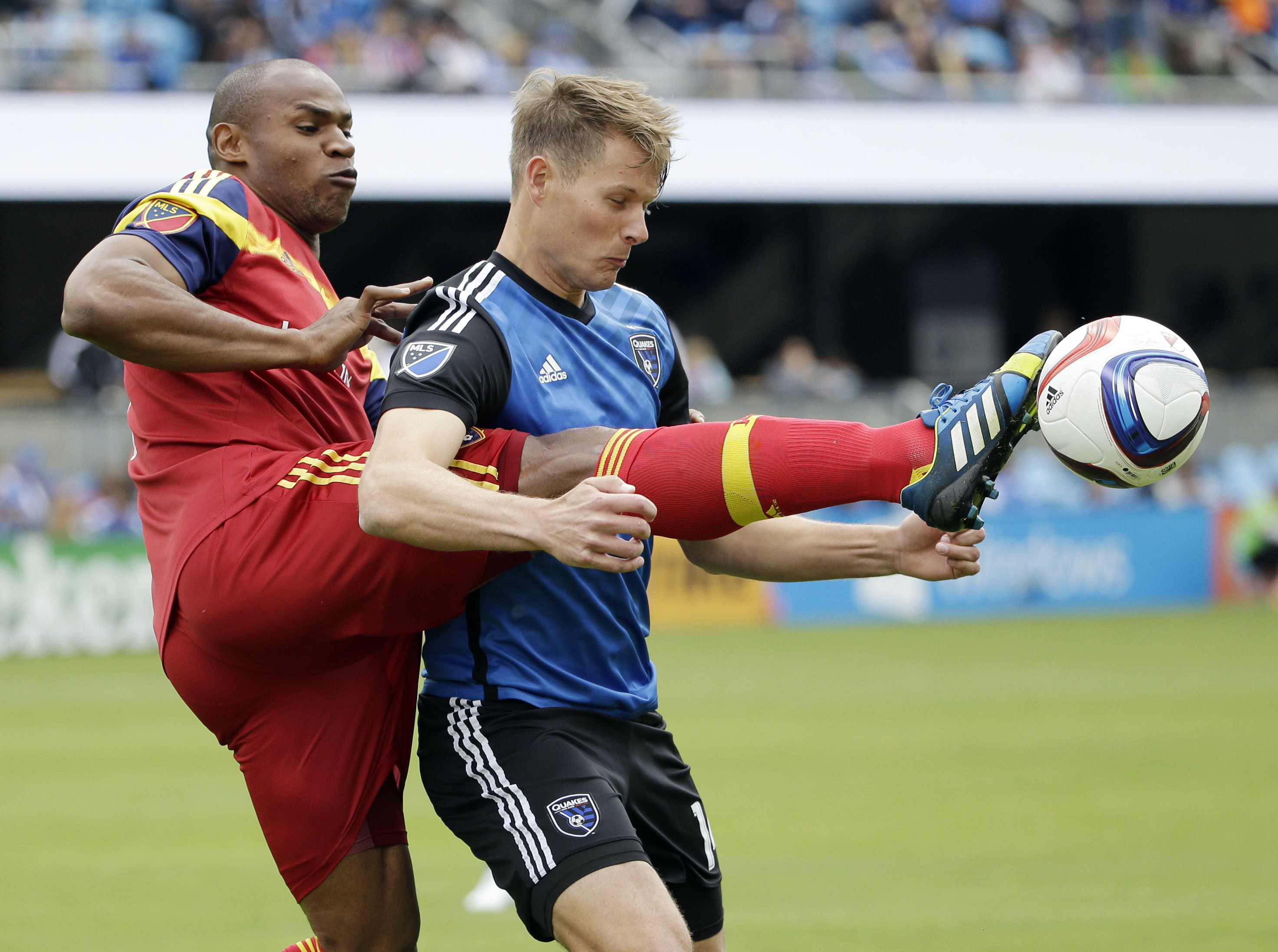 Real Salt Lake's Jamison Olave, left, defends San Jose's Adam Jahn during the first half of an MLS soccer game Sunday, April 5, 2015, in San Jose, Calif. (AP Photo/Marcio Jose Sanchez)