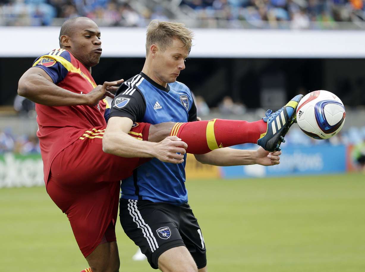 Real Salt Lake's Jamison Olave, left, defends San Jose's Adam Jahn during the first half of an MLS soccer game Sunday, April 5, 2015, in San Jose, Calif. (AP Photo/Marcio Jose Sanchez)