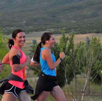 Heather Jones (left) and Kylie Beckstead (right) running at the Utah Valley Marathon in June 2014. (Photo Credit: Utah Valley Marathon, MarathonFoto)