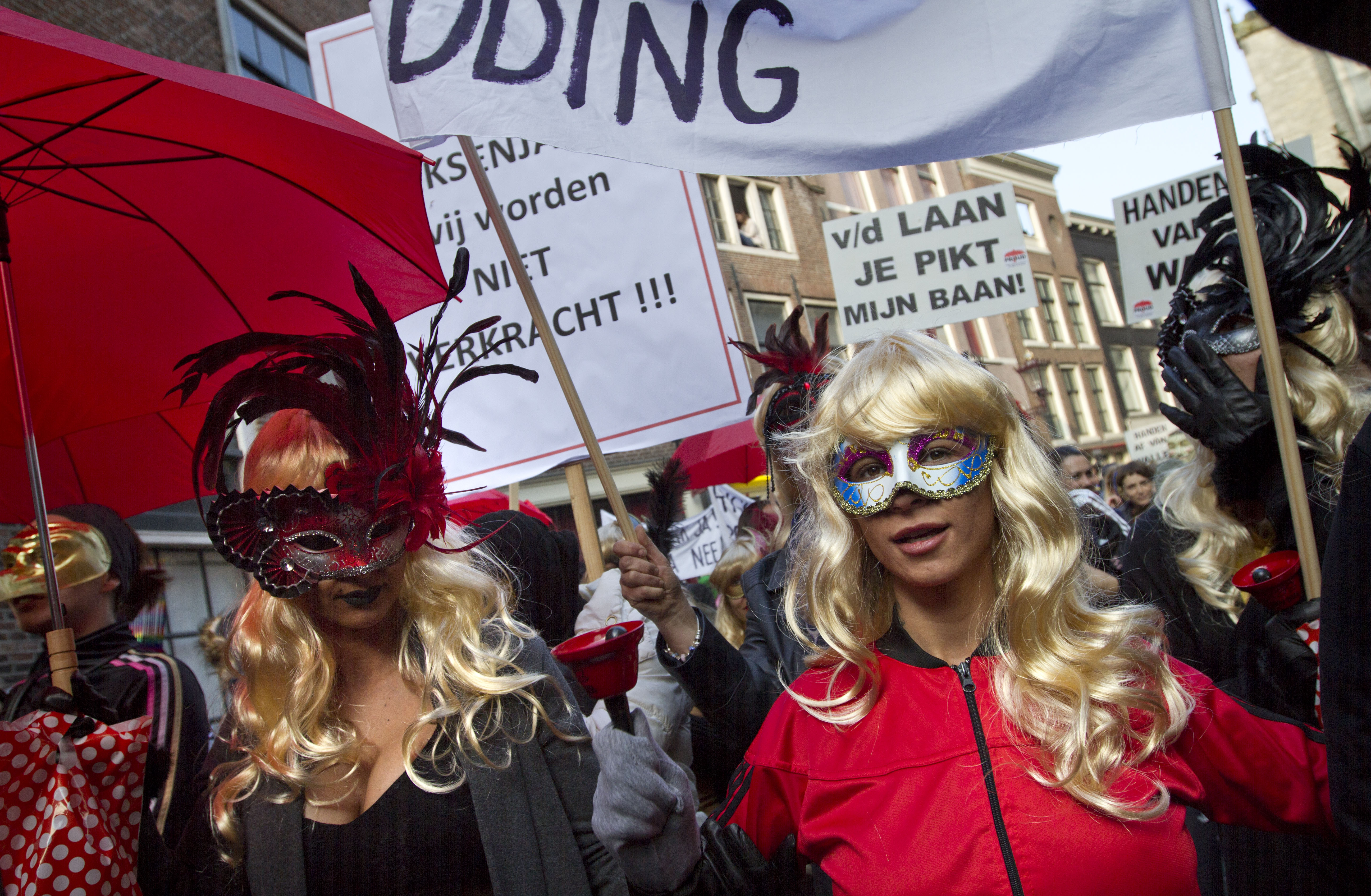 Amsterdam prostitutes protest closure of their windows