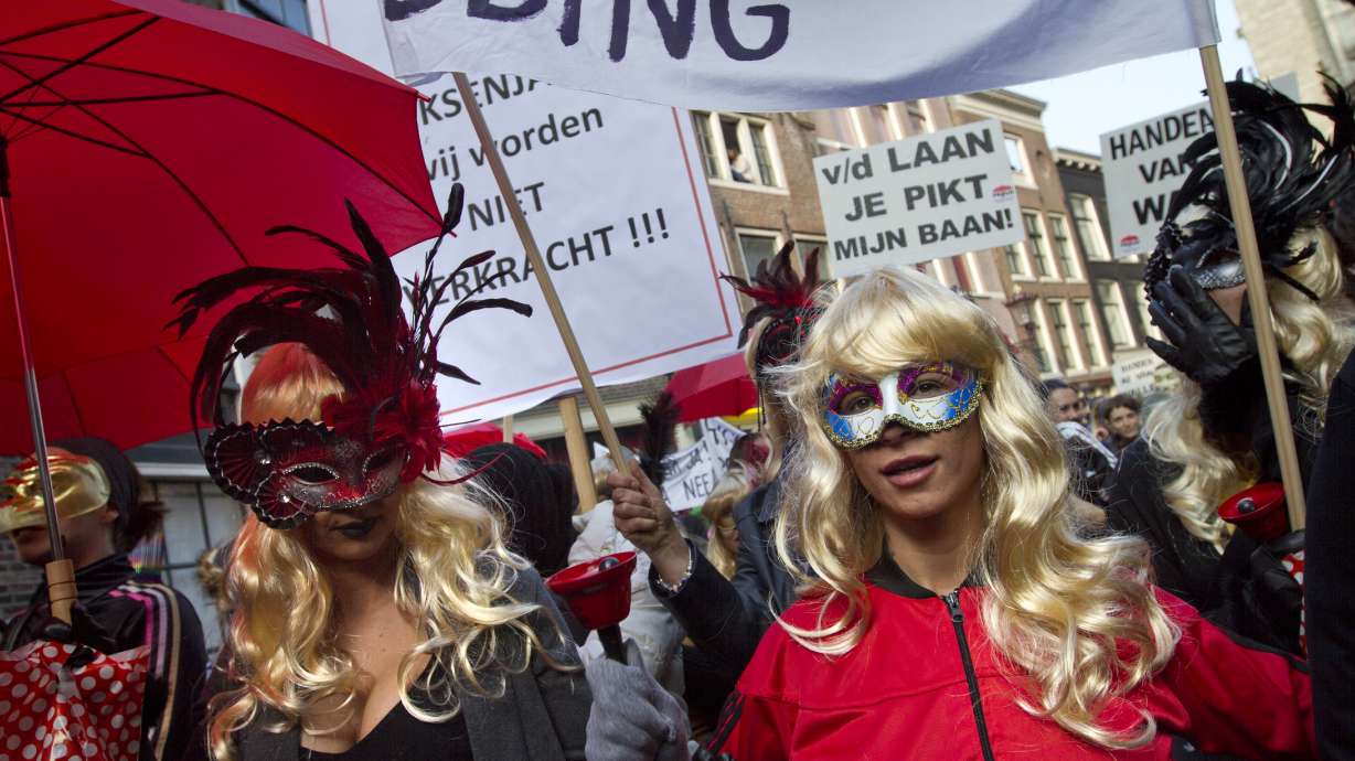 Amsterdam prostitutes protest closure of their windows