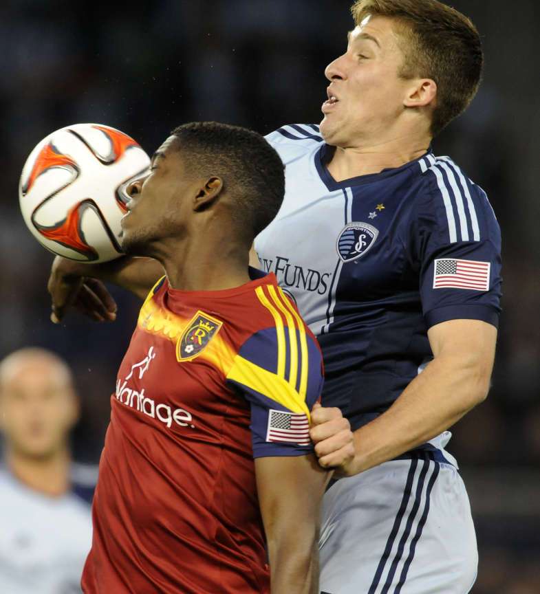 Real Salt Lake's Olmes Garcia heads the ball in front of Sporting KC's Matt Besler during a game at Sporting Park in Kansas City, Kan. on Saturday, April 5, 2014. (Matt Gade/Deseret News)