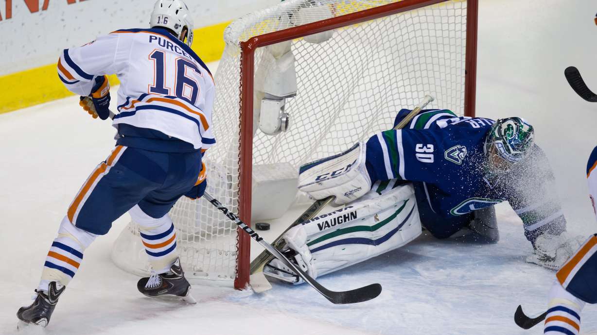 Edler scores in OT to lift Canucks past Oilers in finale