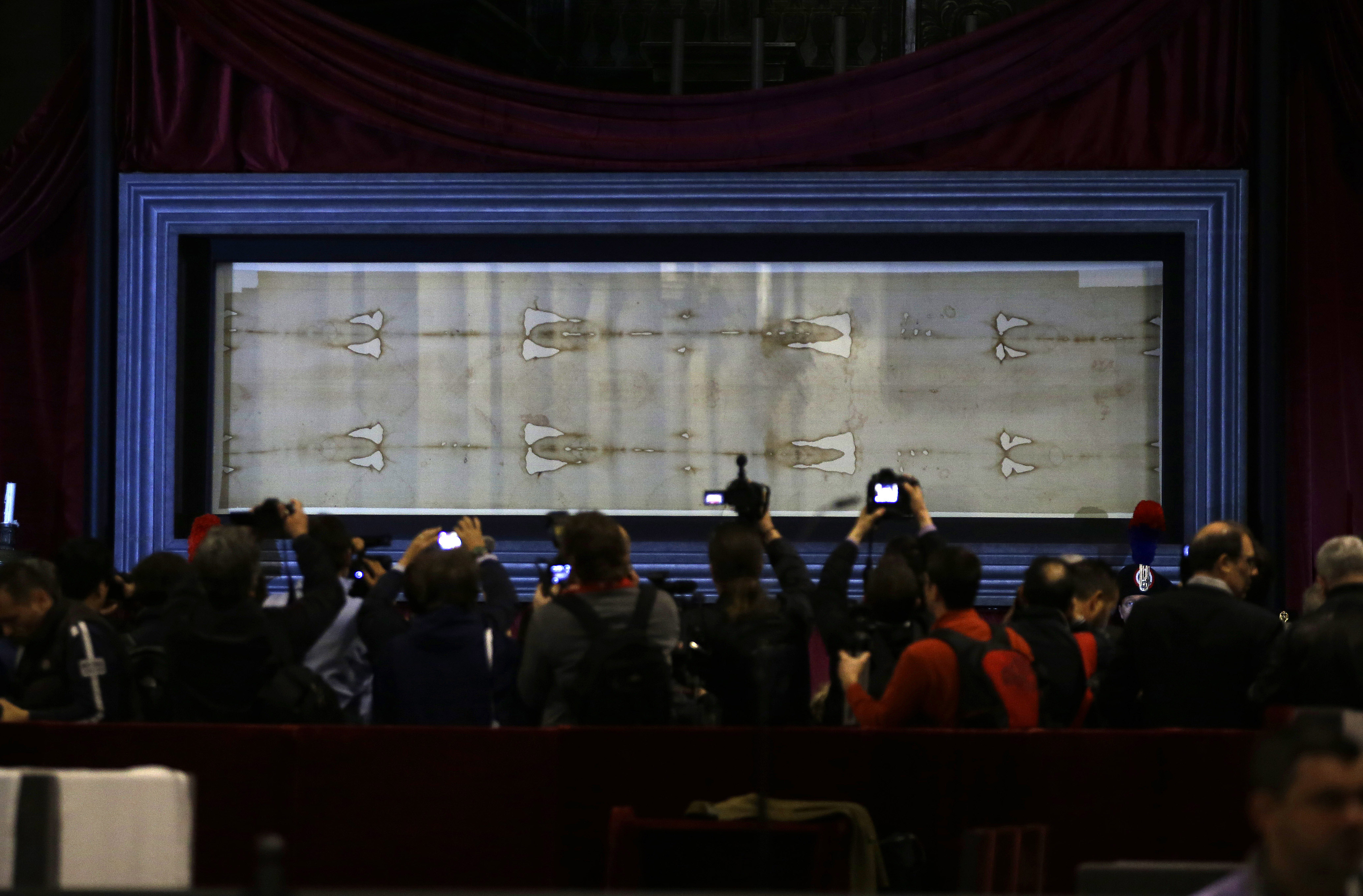 Turin Shroud goes back on display for faithful and curious