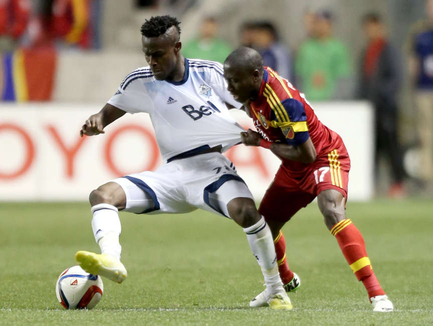 Vancouver's Gershon Koffie kicks the ball away from Real Salt Lake's Demar Phillips during a soccer game at Rio Tinto Stadium in Sandy on April 18, 2015. (Photo: Kristin Murphy, Deseret News)