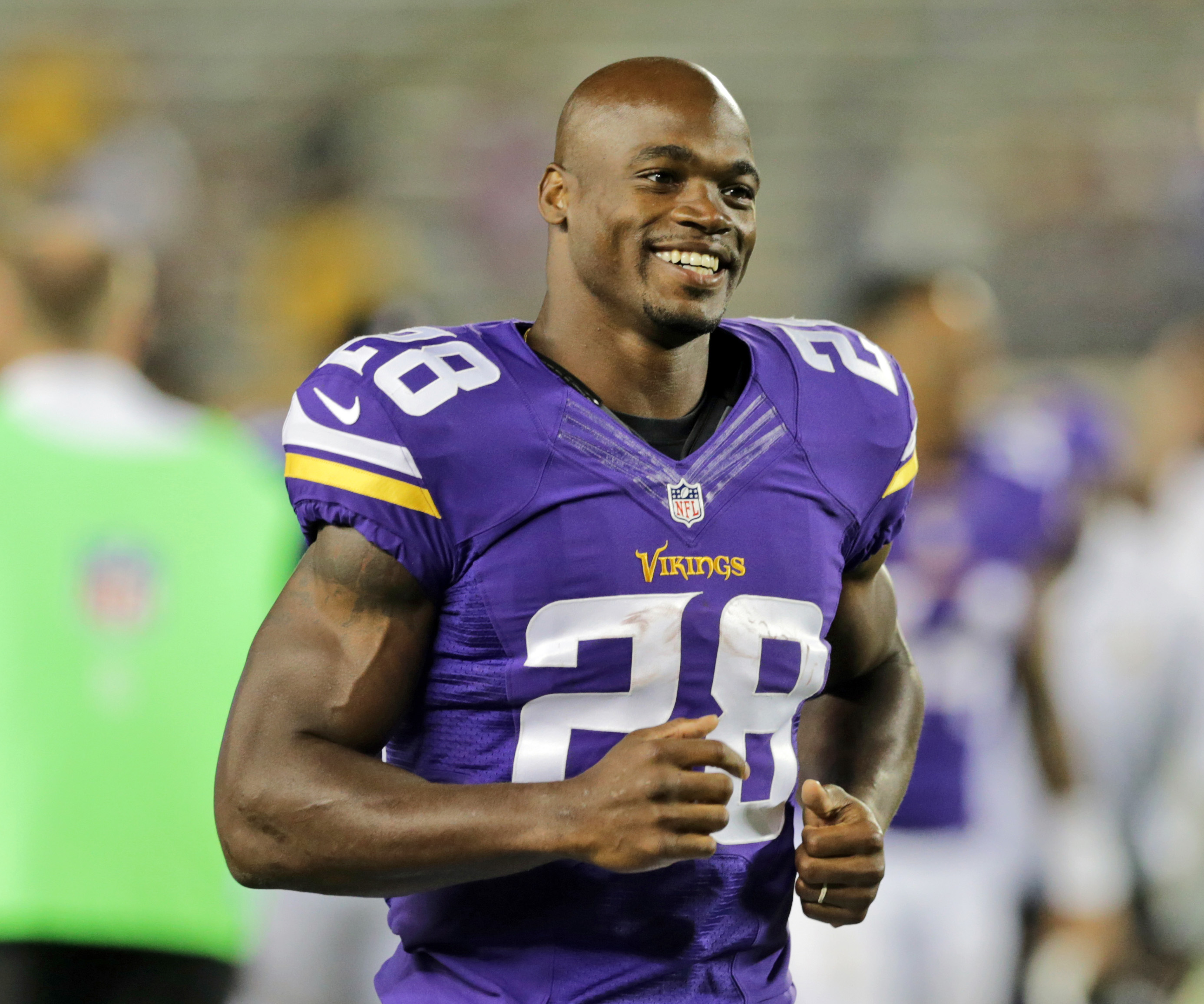 AP source: Peterson stays home from Vikings workouts
