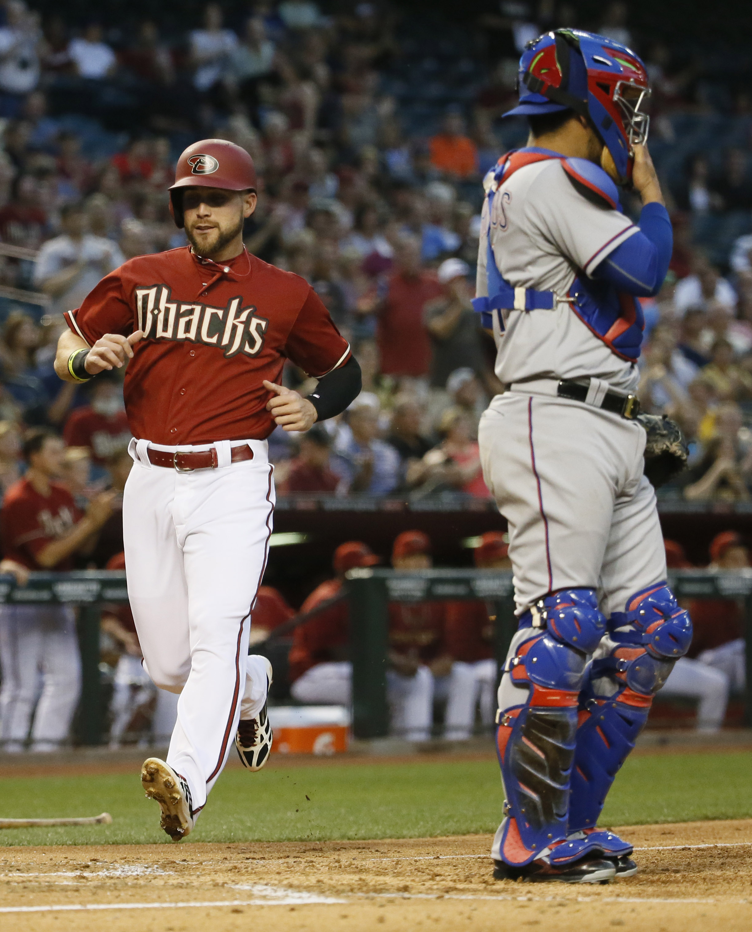 Effectively-wild Bradley leads Arizona to 8-5 win over Texas