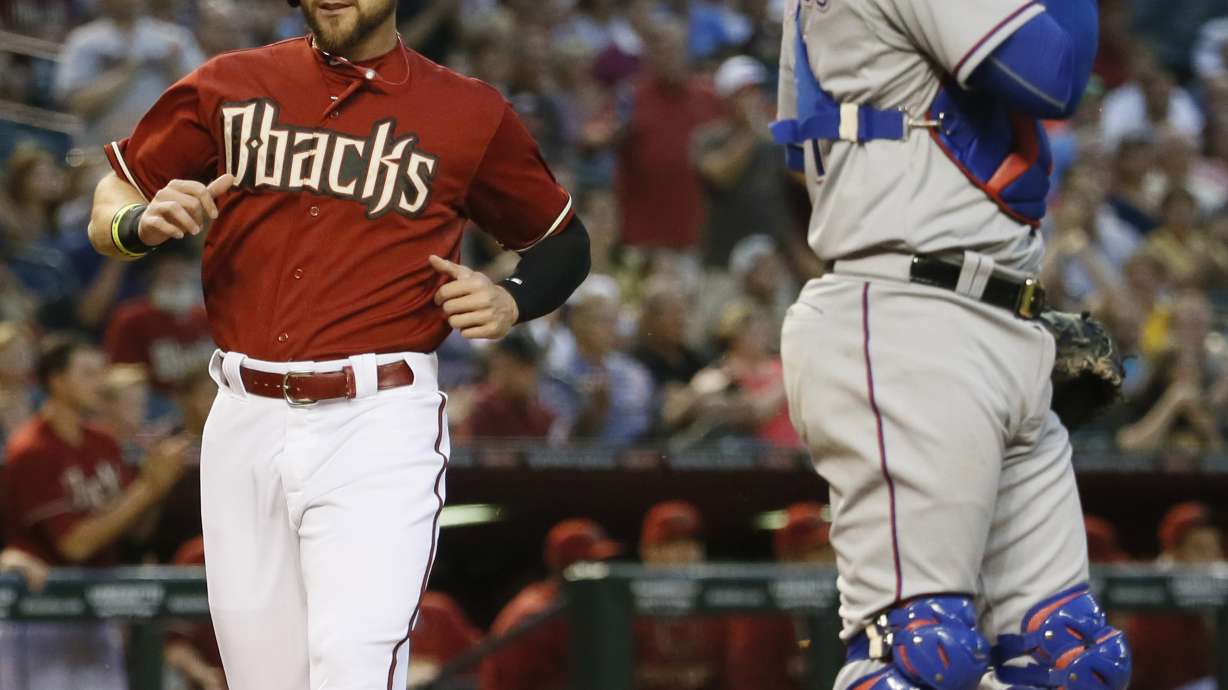 Effectively-wild Bradley leads Arizona to 8-5 win over Texas