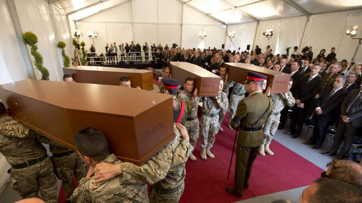 Europe buries migrants as lawyer defends suspected captain