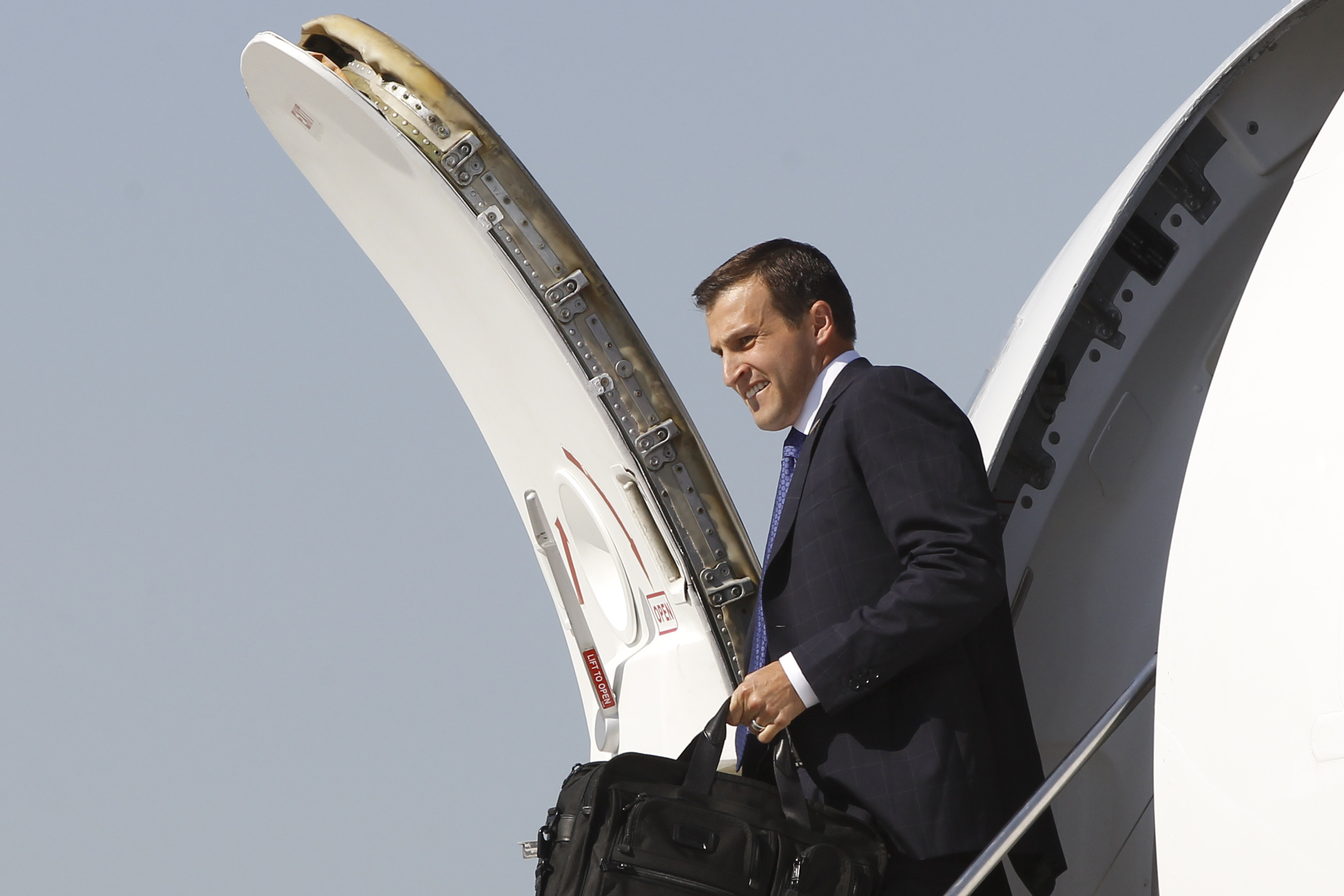 FILE - Spencer Zwick, national finance chair for Republican presidential candidate and former Massachusetts Gov. Mitt Romney, steps off his charter plane in Chicago before Romney campaigns at Acme Industries in Elk Grove Village, Ill.,Tuesday, Aug. 7, 2012. (AP Photo/Charles Dharapak)