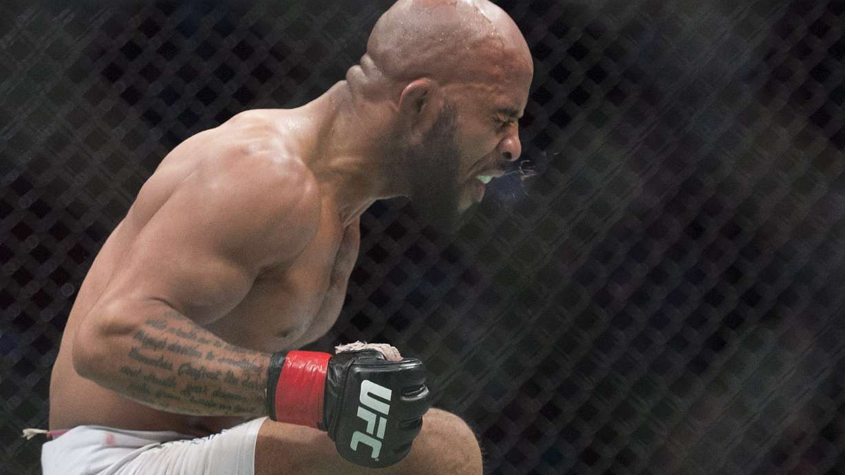 Flyweight champ Demetrious Johnson retains title at UFC 186