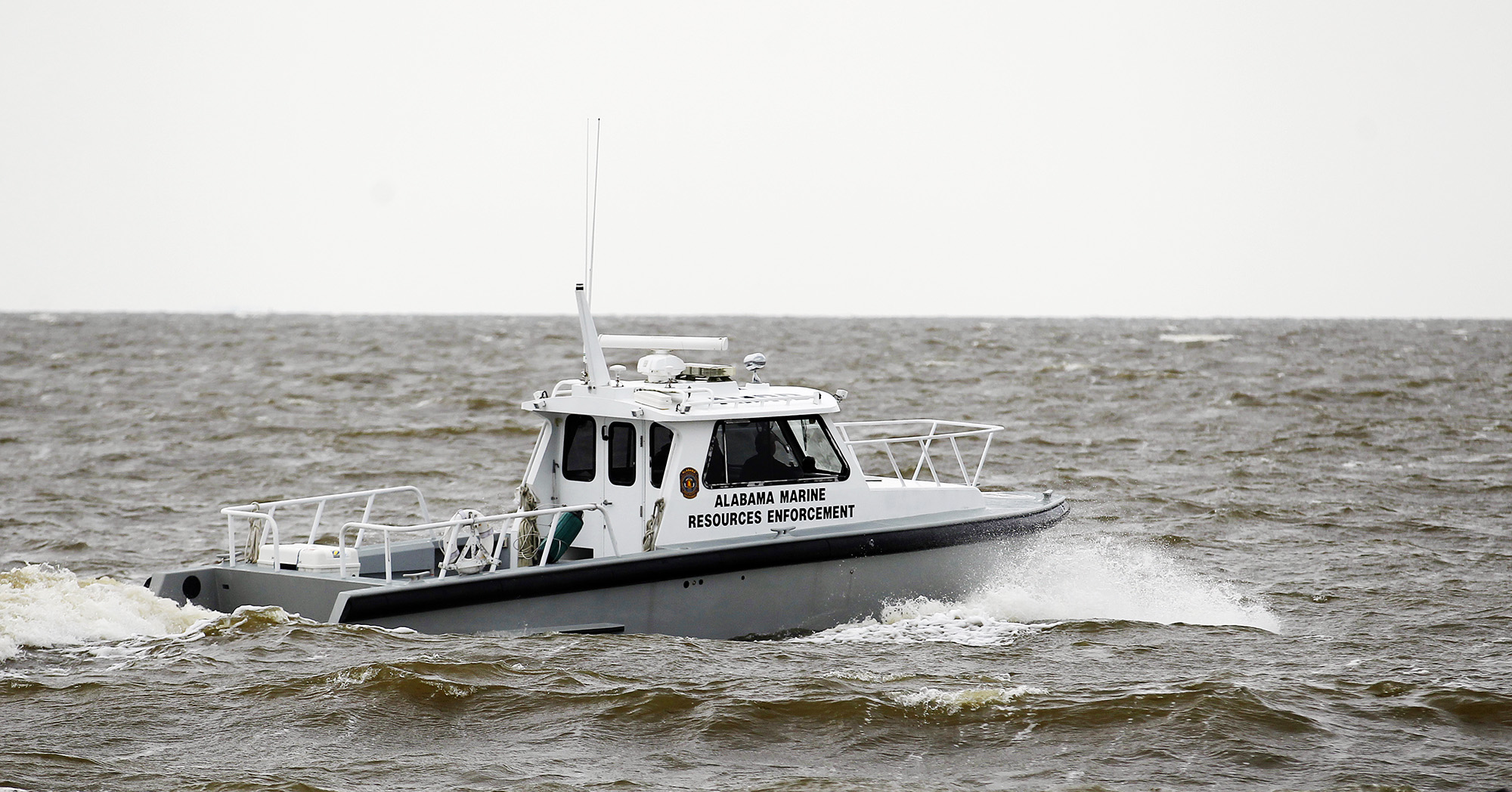 Wife: Sailor died trying to save others; 3 boaters missing