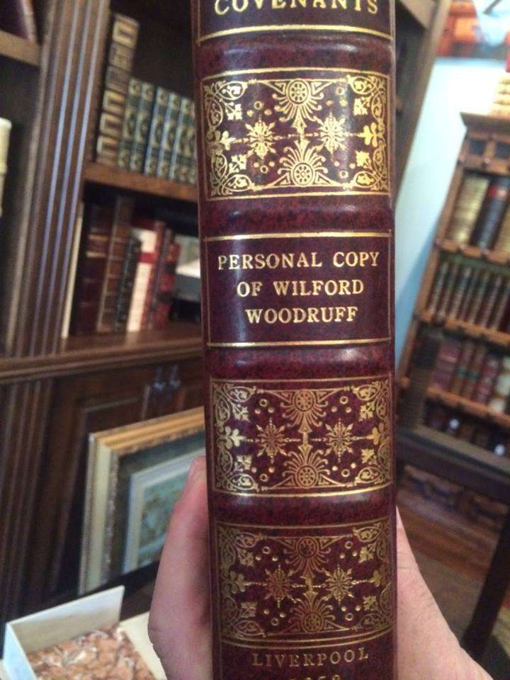 Moon shows off Wilford Woodruff's personal copy of a Doctrine and Covenants book. (Photo: Jen Jacobson)