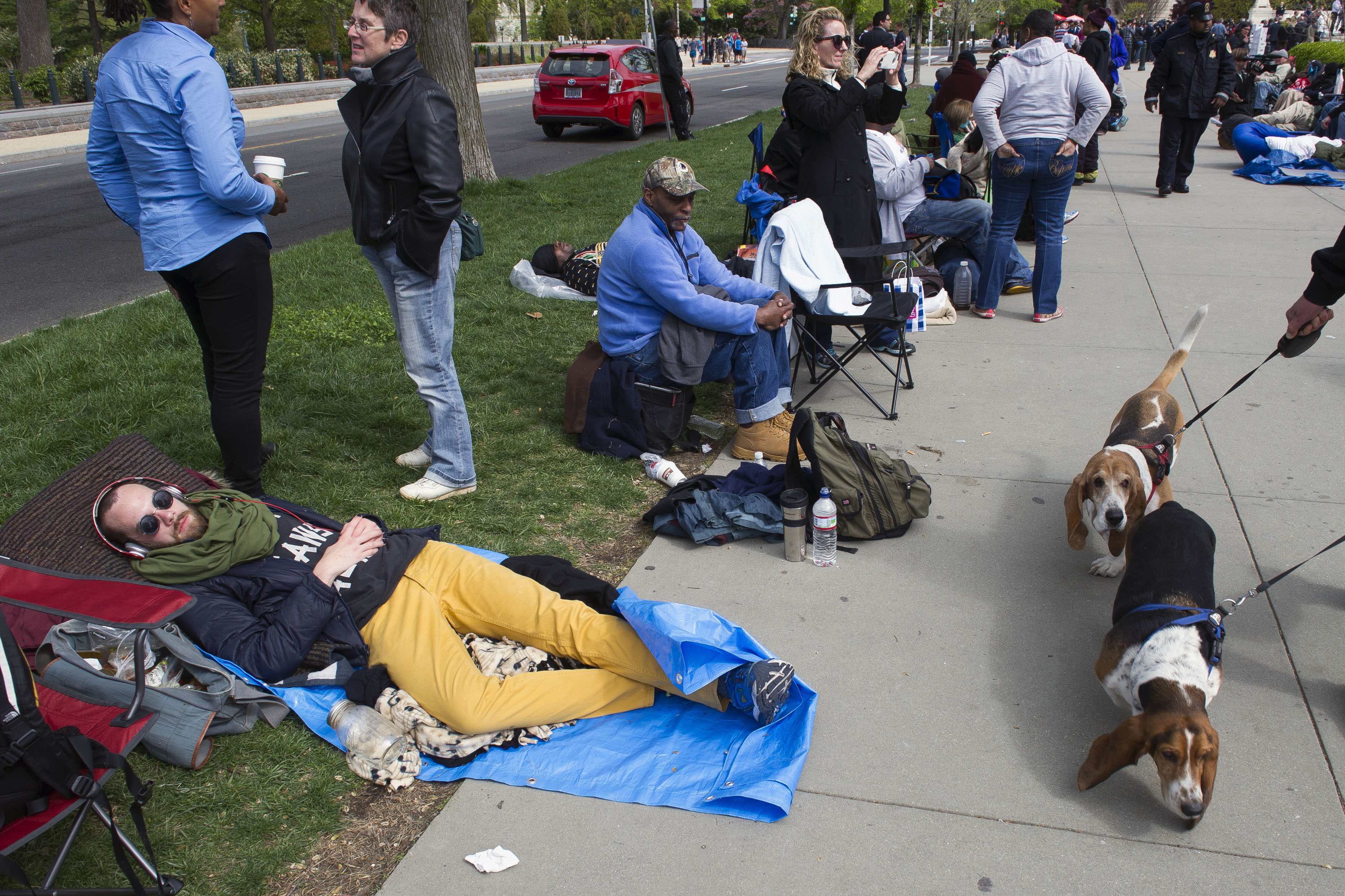 People wait in line, some for three days, for a seat in the Tuesday's gay marriage hearing at the Supreme Court in Washington, Monday, April 27, 2015. The opponents of same-sex marriage are urging the court to resist embracing what they see as a radical change in society's view of what constitutes marriage. (AP Photo/Cliff Owen)