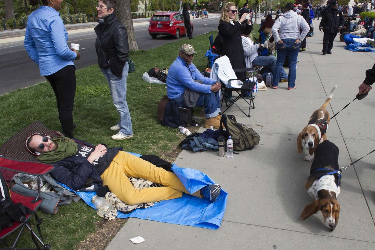 People wait in line, some for three days, for a seat in the Tuesday's gay marriage hearing at the Supreme Court in Washington, Monday, April 27, 2015. The opponents of same-sex marriage are urging the court to resist embracing what they see as a radical change in society's view of what constitutes marriage. (AP Photo/Cliff Owen)