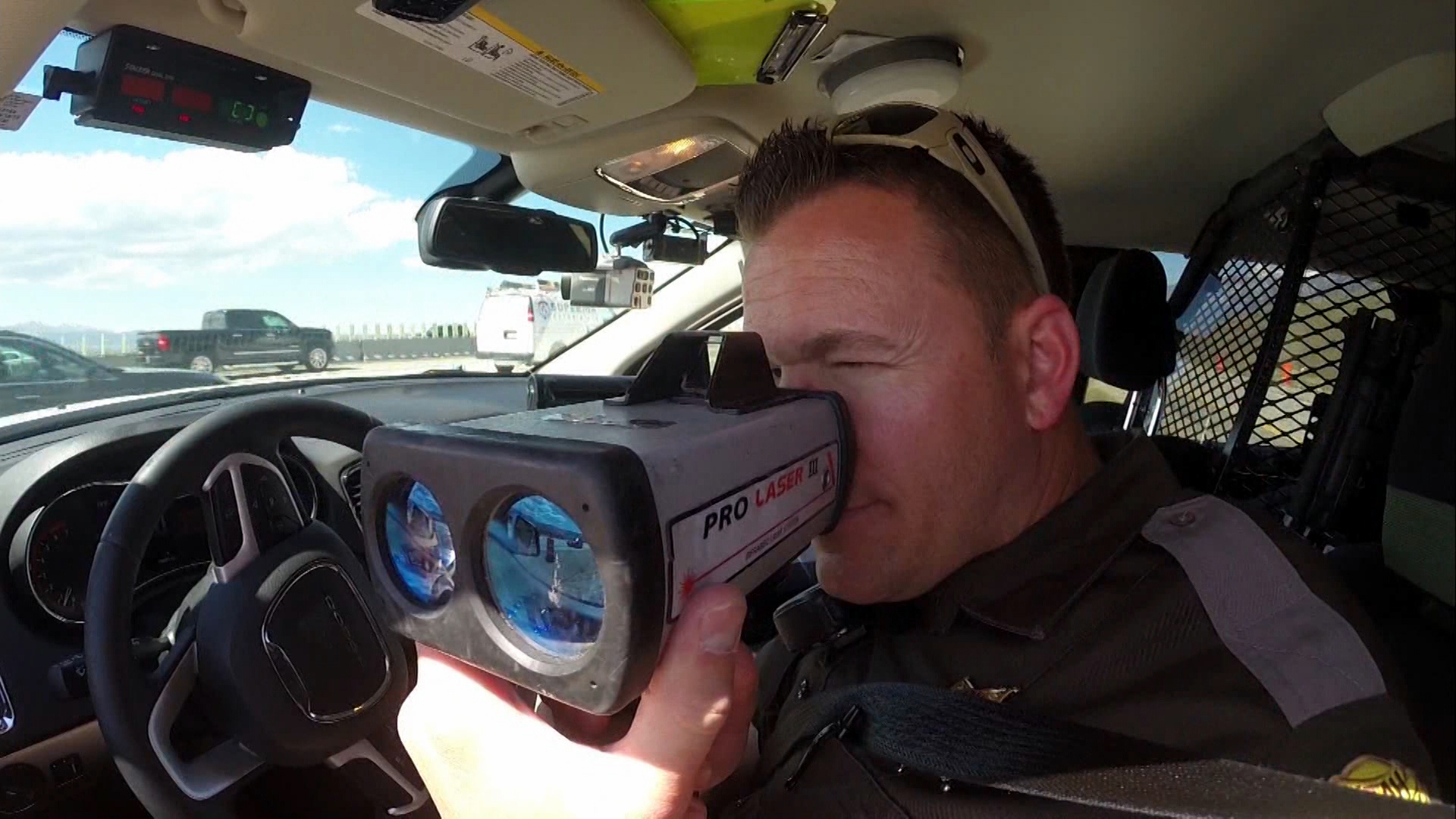 A Utah Highway Patrol officer watches for speeding drivers at the Point of the Mountain on April 29, 2015. The UHP hopes the public will slow down for the July 4 holiday weekend.
