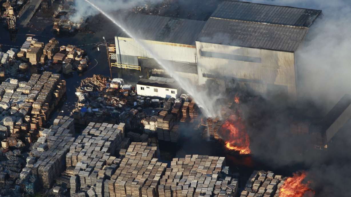 Fire official says smoke from warehouse fire likely toxic