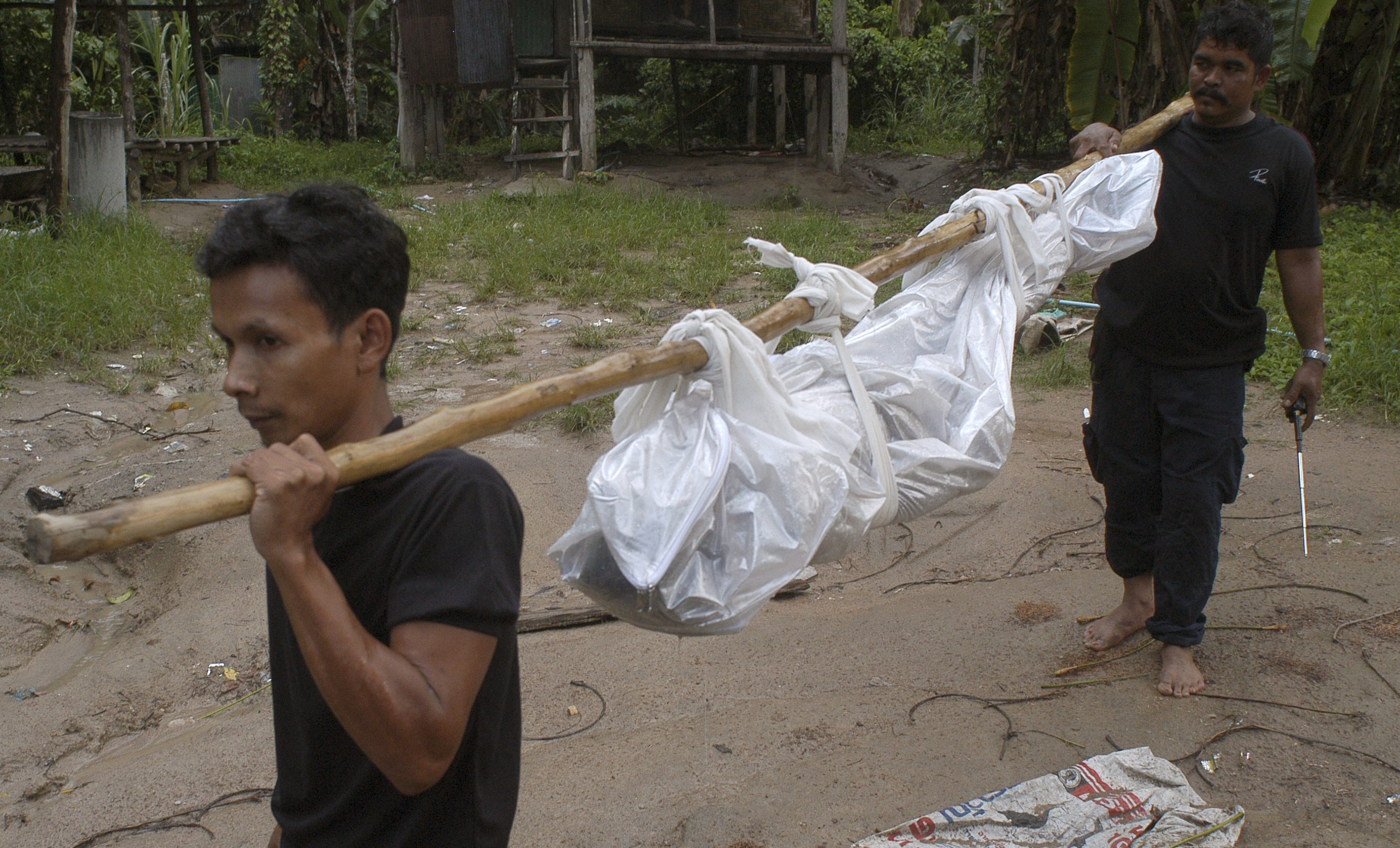 Thai police dig up 26 bodies at suspected trafficking camp