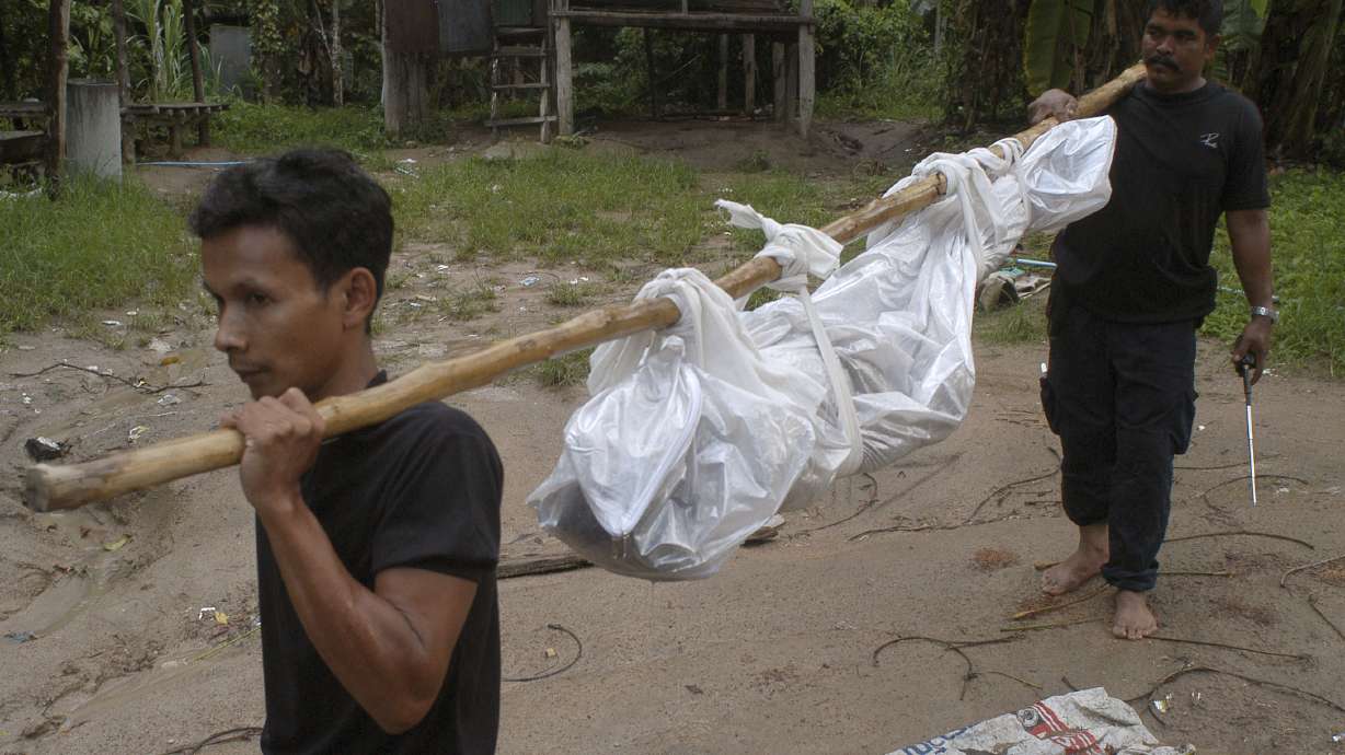 Thai police dig up 26 bodies at suspected trafficking camp