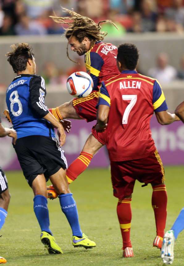 Real Salt Lake's Kyle Beckerman hits a header against the San Jose Earthquakes at Rio Tinto Stadium in Sandy on Friday, May 1, 2015 while first-half substitute Jordan Allen looks on. The two teams played to a 1-1 draw. (Photo: Kristin Murphy/Deseret News)