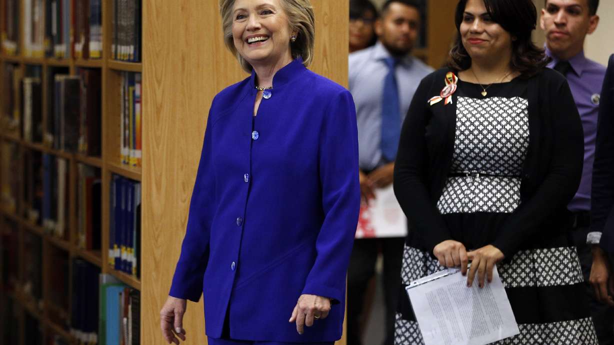 Clinton challenges Bush on immigration as GOP shifts