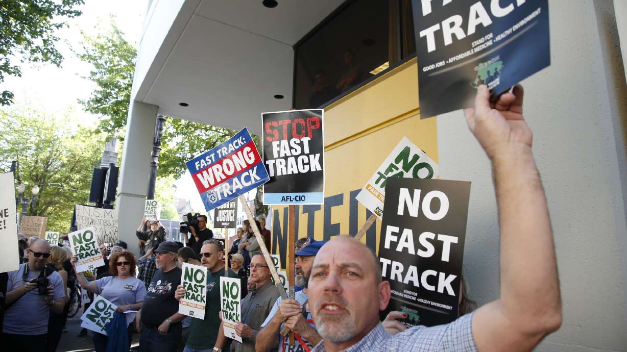 Obama to donors: More work to do, cites trade, free tuition