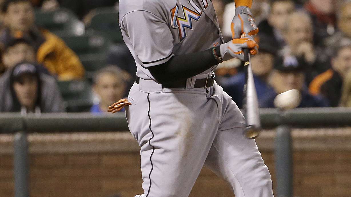 Haren uses bat, arm to lead Marlins past Giants 7-2