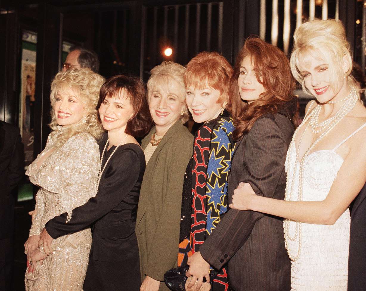 Stars of the film Steel Magnolias pose backstage at the Ziegfeld Theater in New York Nov. 5, 1989 at the movie's premiere. Shown from left: Dolly Parton, Sally Field, Olympia Dukakis, Shirley MacLaine, Julia Roberts and Daryl Hannah. (Ed Bailey/AP Photo)