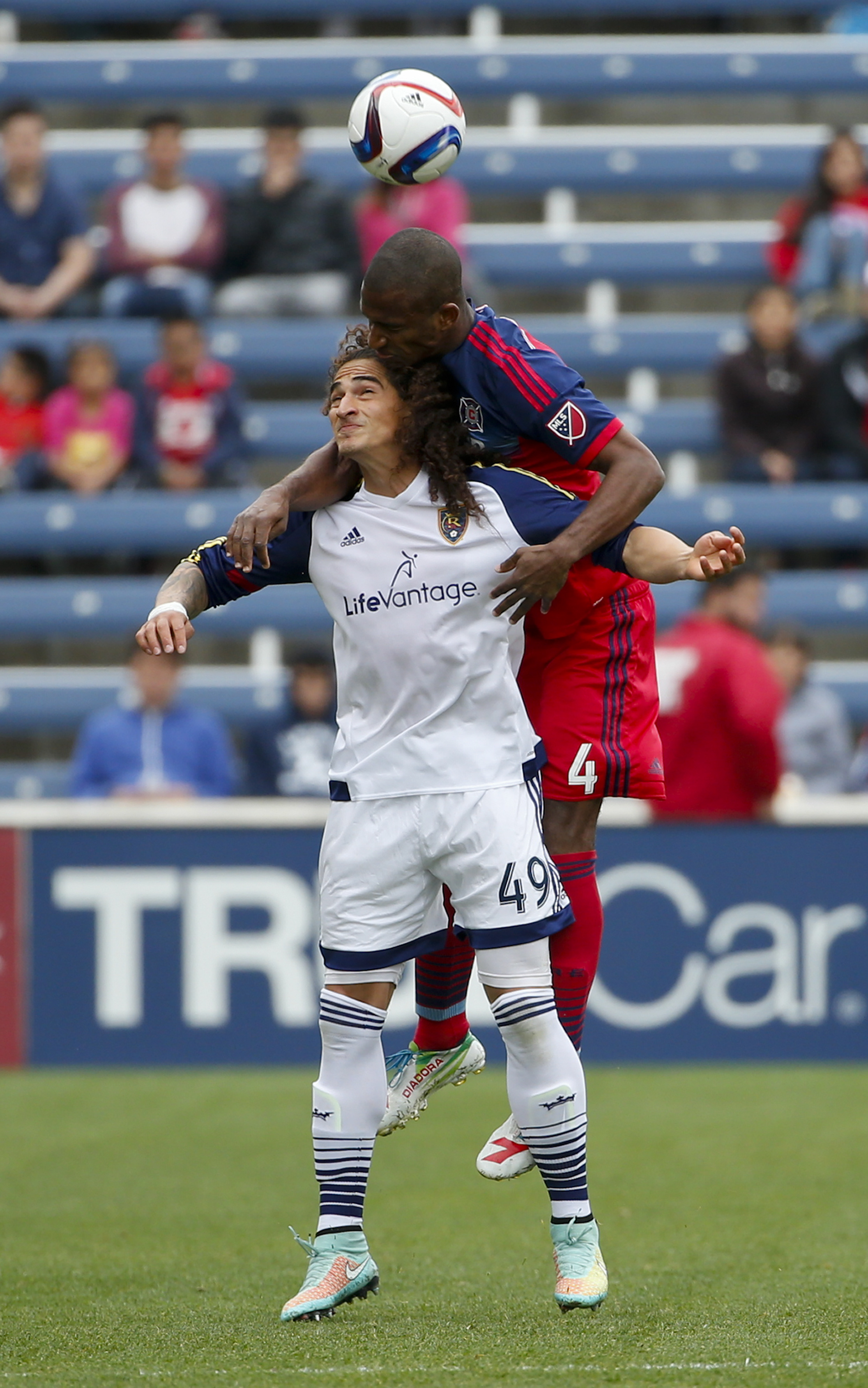 Real Salt Lake forward Devon Sandoval goes for a header against Chicago Fire defender Adailton during the first half of an MLS soccer game on Saturday, May 9, 2015, at Toyota Park in Bridgeview, Ill. (AP Photo/Kamil Krzaczynski)