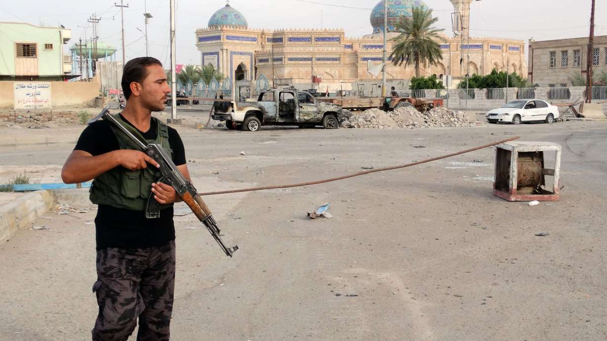 Bombings kill at least 14 in, outside Baghdad