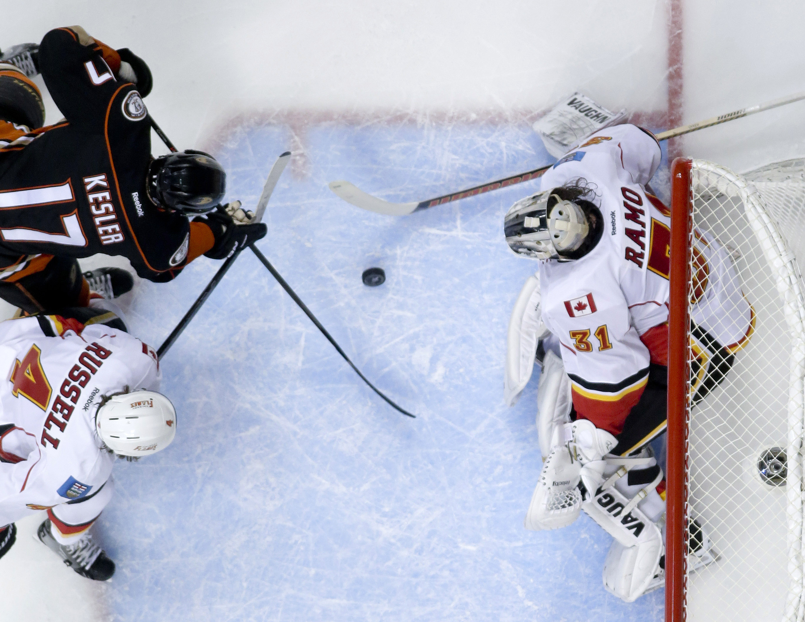 Perry puts Ducks past Flames 3-2 in OT, into conf. finals