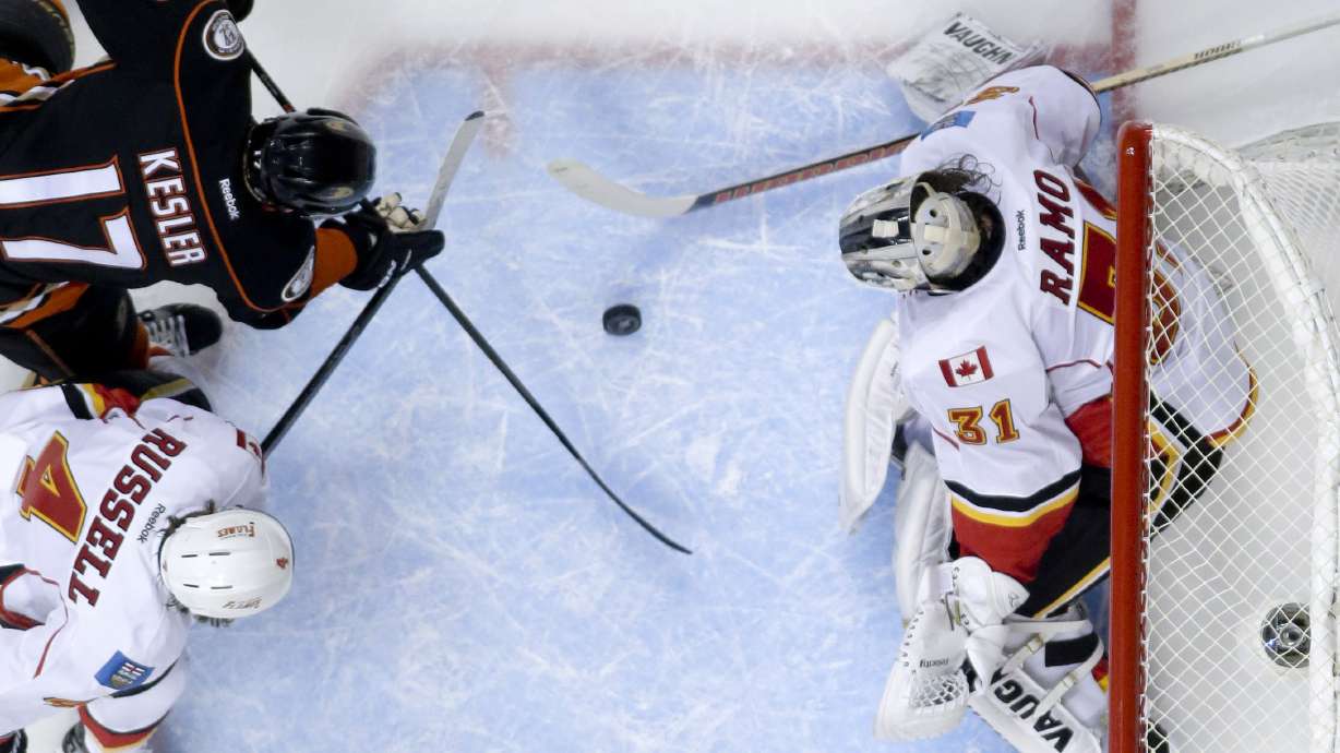 Perry puts Ducks past Flames 3-2 in OT, into conf. finals