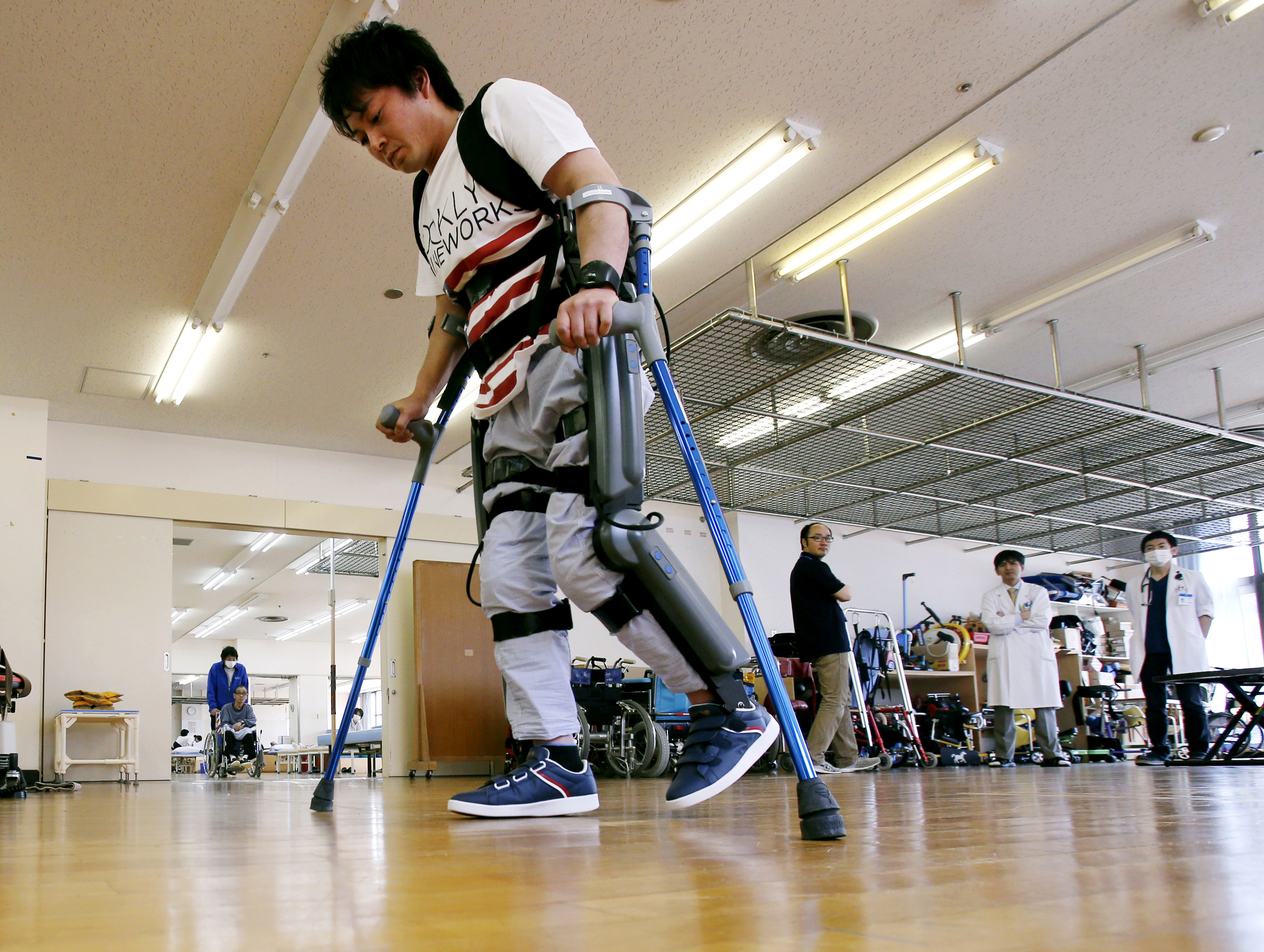 Exoskeleton that helps paralyzed walk faces barrier in Japan