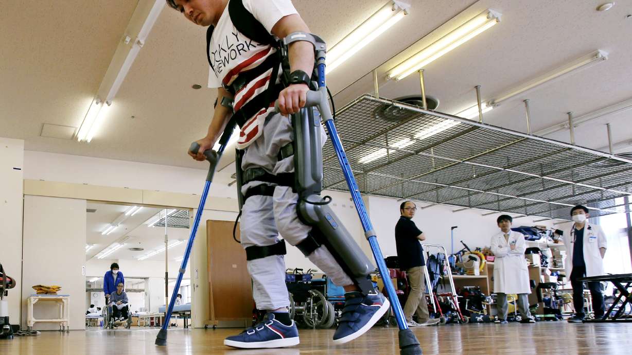 Exoskeleton that helps paralyzed walk faces barrier in Japan