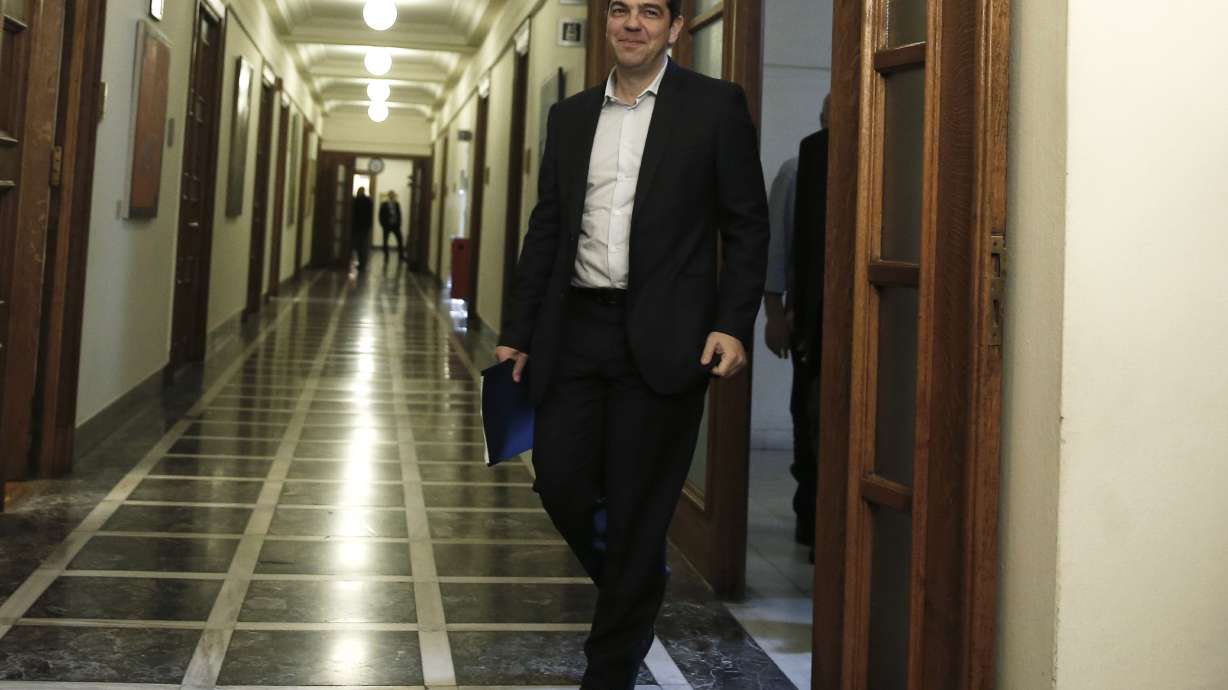 Greek leader holds government meeting as recession returns