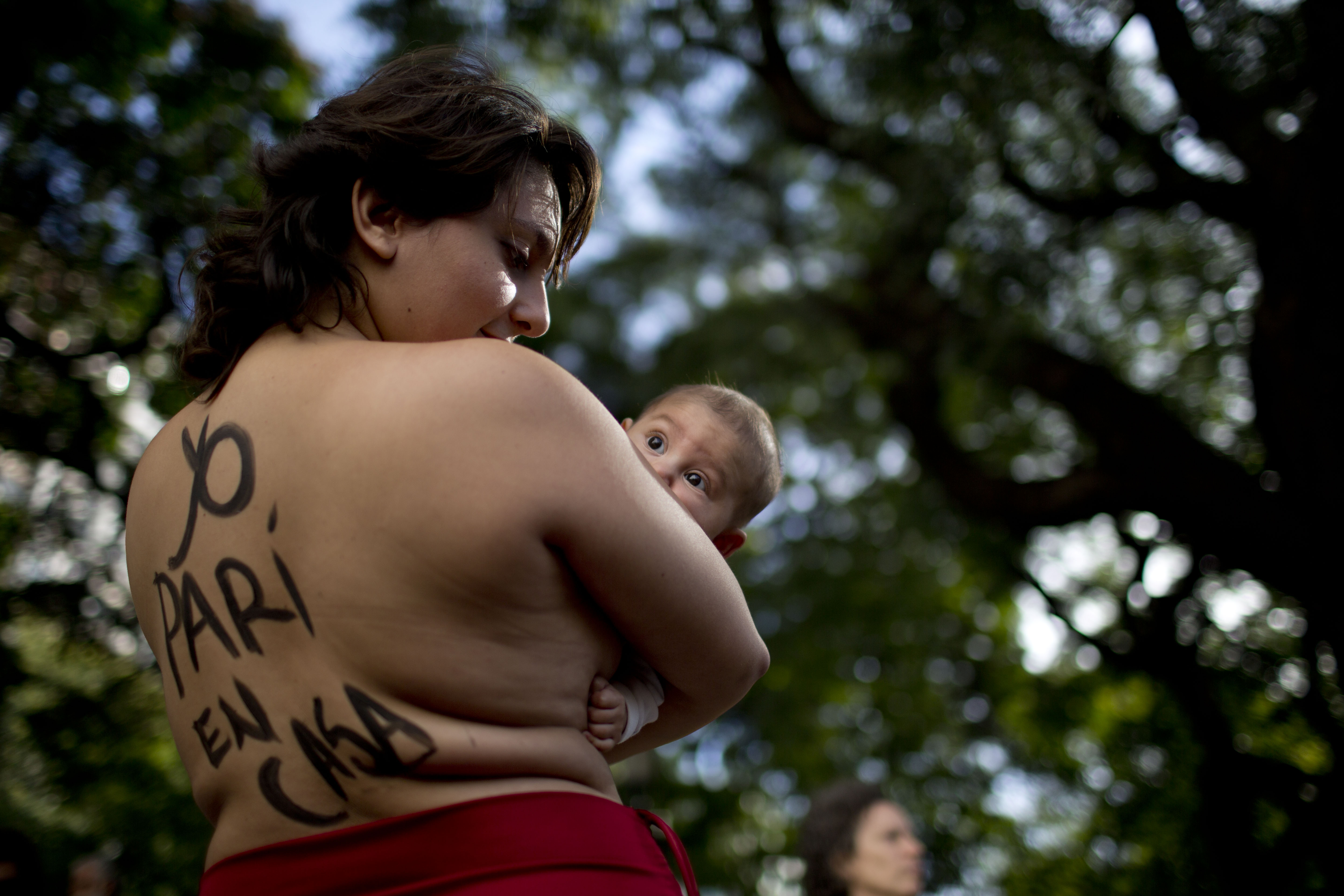 Argentina midwives bare breasts to defend home births
