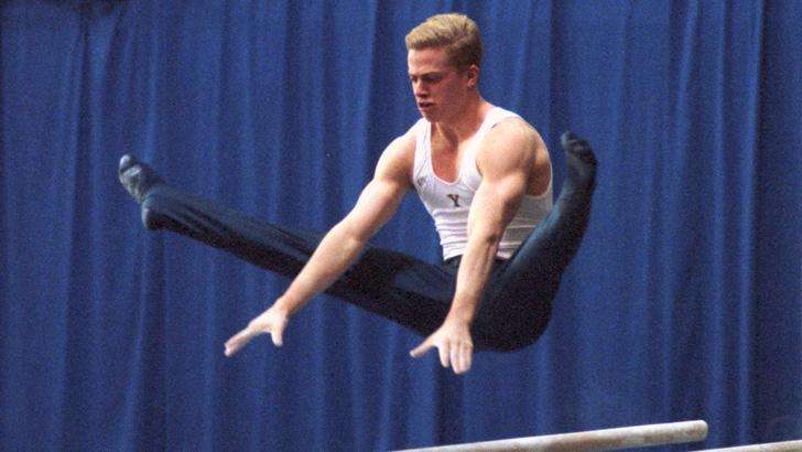 Former BYU All-American gymnast Guard Young was named the head women's gymnastics coach at his alma mater for nine years.