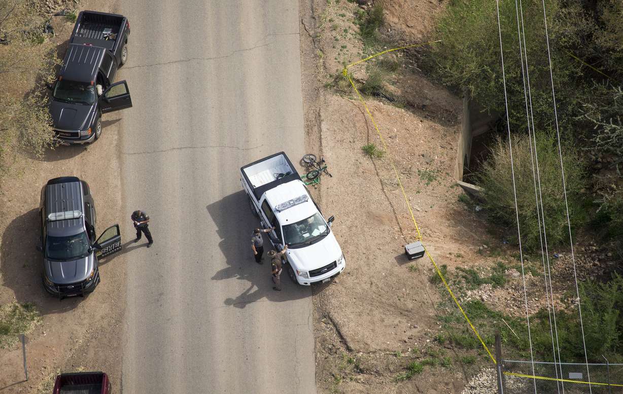 Police officers investigate an officer-involved shooting Sunday, May 3, 2015, in Roosevelt. (Photo: Scott G Winterton, Deseret News)
