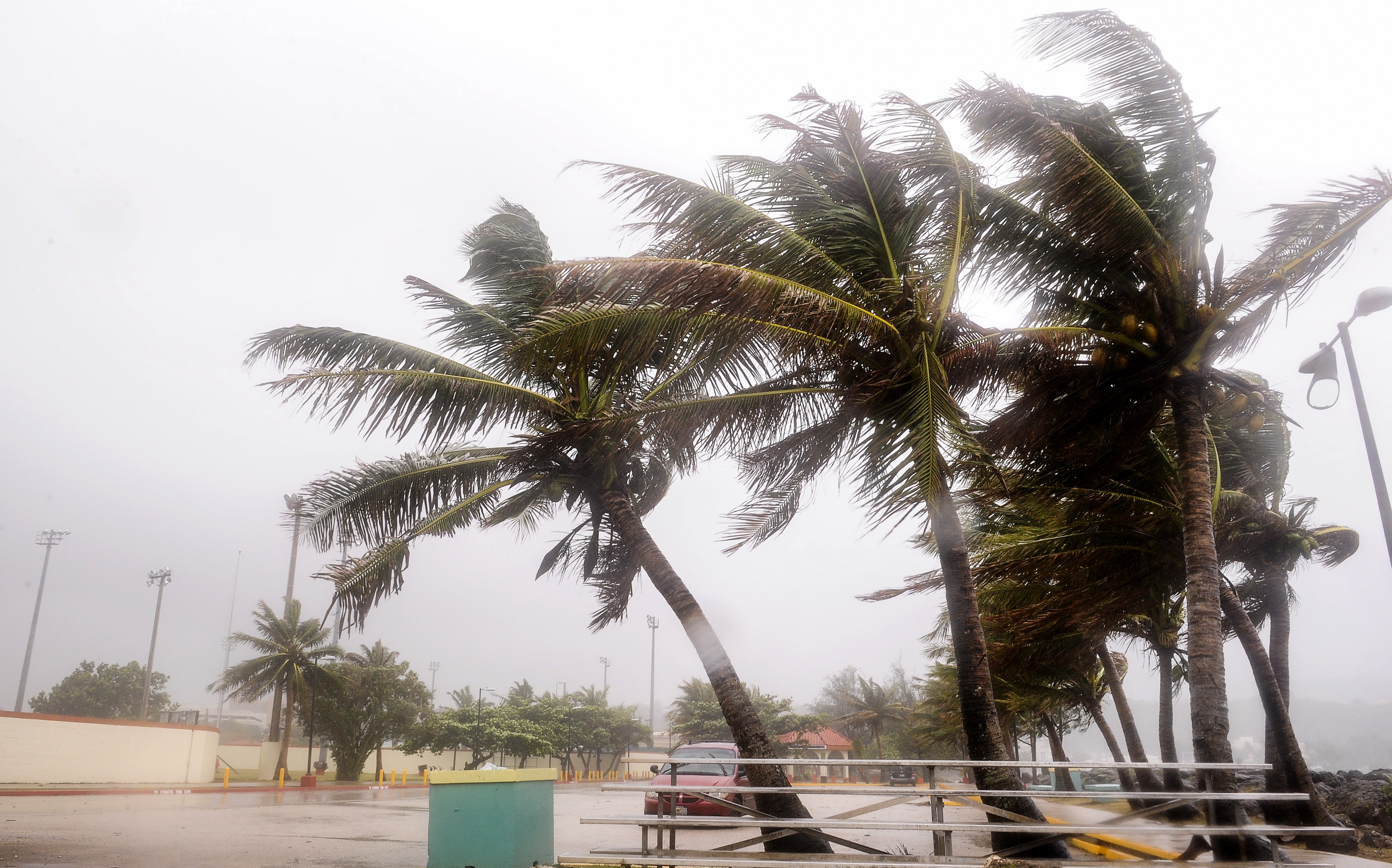 Residents clean up after typhoon pelts Guam with winds, rain