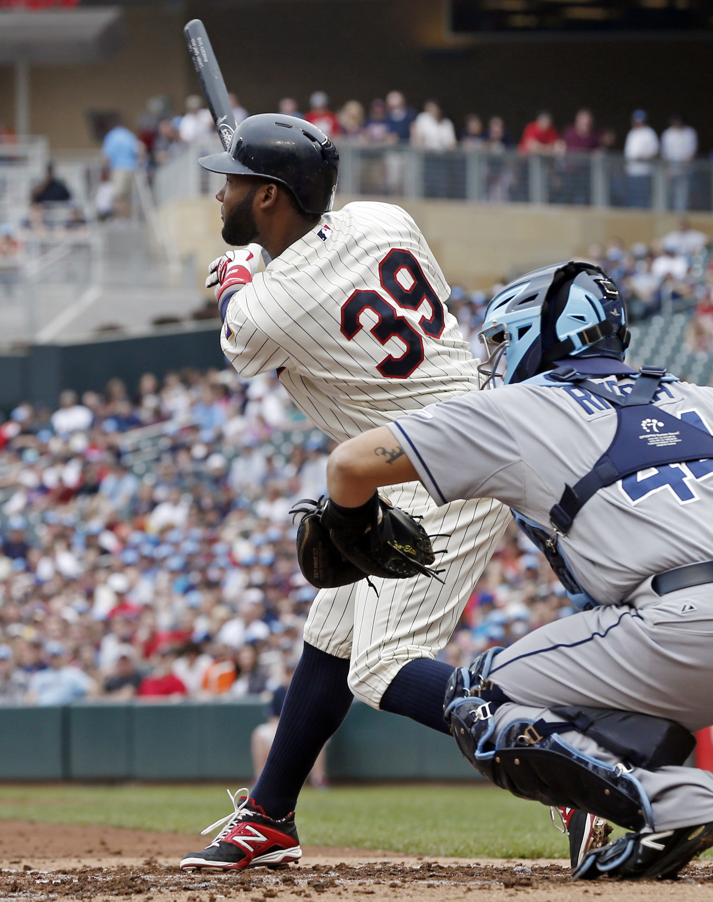 Twins take advantage of rare Rays' error for 6-4 win
