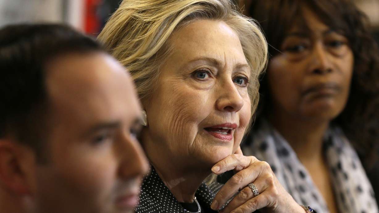 Clinton defends financial regs for big banks, dodges trade