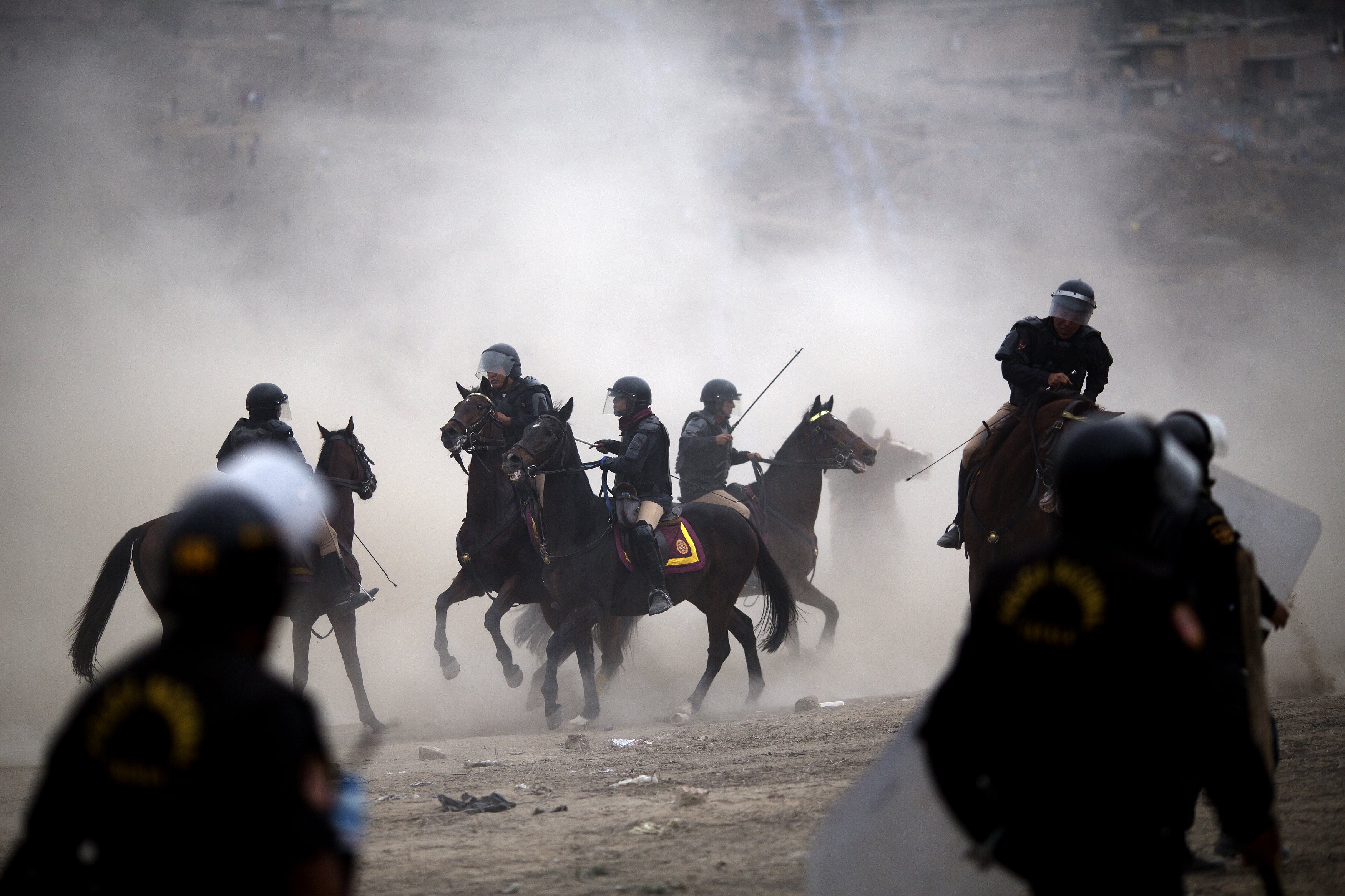 Squatters clash with police in Peru's capital